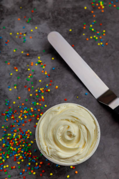 istock Textured whipped cream in a bowl with spatula. 1325310357