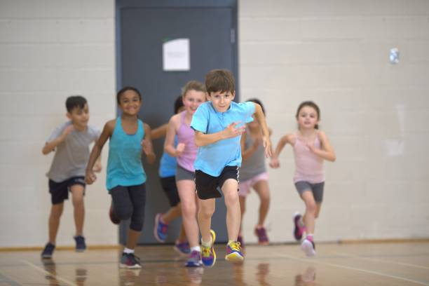 istock Group of children running during a physical education class 1325313663