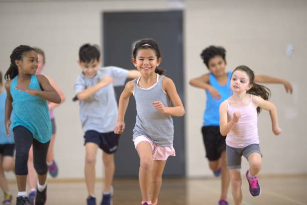 istock Group of children running during a physical education class 1325313666