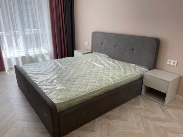 istock interior of a bedroom with new grey bed 1325314288