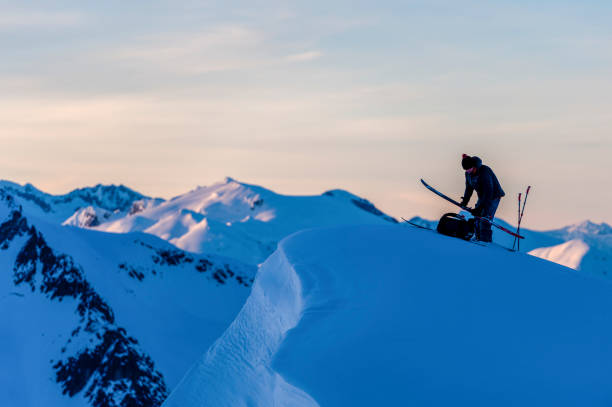 istock Backcountry skier prepares for descent at sunrise 1325314296