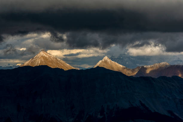 istock Scenic view of mountain ranges covered in dense clouds 1325315143