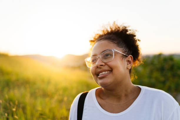 istock Smiling woman at sunset 1325324596