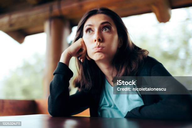 Sad Upset Woman Waiting Alone In A Restaurant Being Stood Up Stock Photo - Download Image Now
