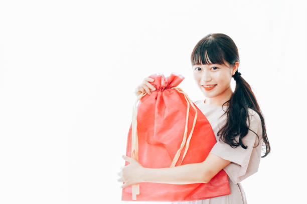 istock Young Woman Receiving a Gift 1325327408