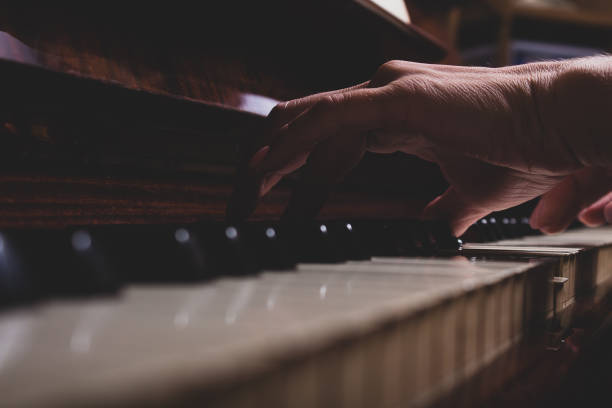 istock Girl and piano at home. Selective focus. 1325328486