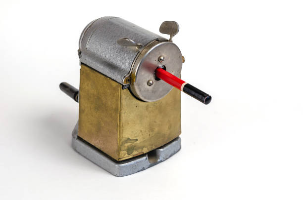 istock Wooden pencil and vintage sharpener on white background. Manual metal tool for sharpening wooden pencils. 1325330343