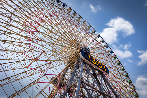Yokohama, Kanagawa Prefecture, Japan - May 30, 2021: The Cosmo Clock 21 Ferris Wheel sits in the heart of the downtown district.