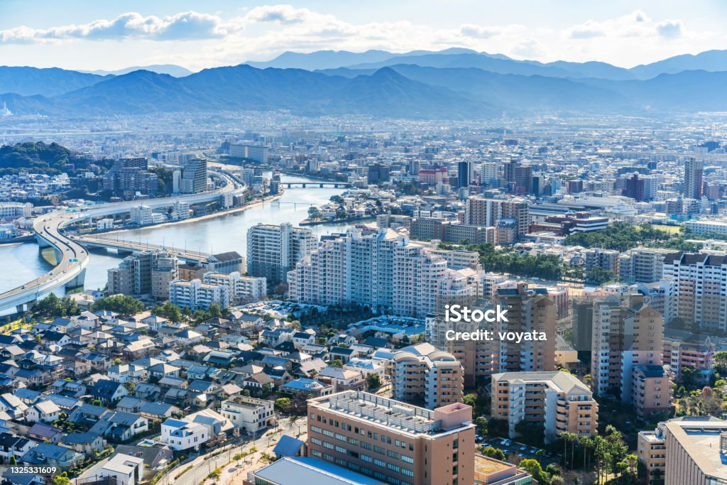 Modern city skyline aerial view in Fukuoka, Japan Asia Business concept for real estate and corporate construction - panoramic urban city aerial view under bright blue sky and sun in Fukuoka Japan Fukuoka City Stock Photo