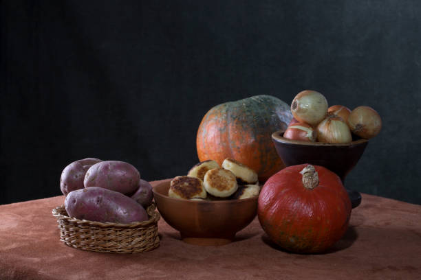 istock Still life with pumpkins, cheesecakes, potatoes and onions 1325337780