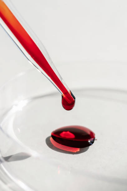istock The hand holds a test tube with blood. 1325341363