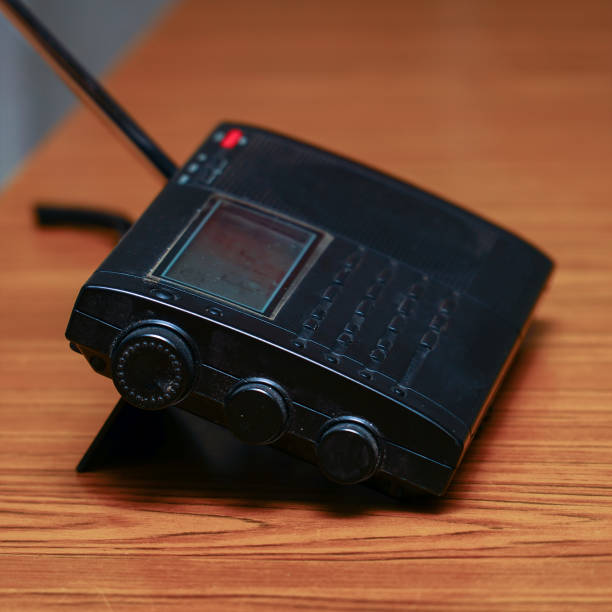 istock Black analog radio receiver on wooden table 1325344453