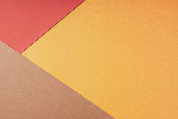 istock Geometric abstract composition made of colored paper, flat, lay, top view, copy space. Autumn background in warm bright red-brown shades. Creative minimal layout design. Paper texture 1325344656
