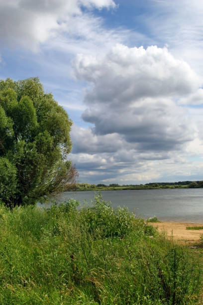 istock Cumulus clouds. Landscape with the Volkhov River. 1325345530
