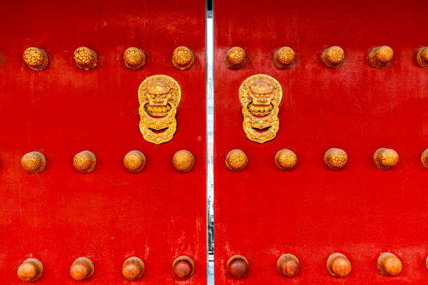 istock Chinese red door with copper lion 1325345631
