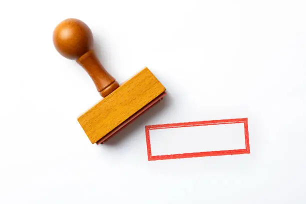 Photo of Wooden blank stamp on white background