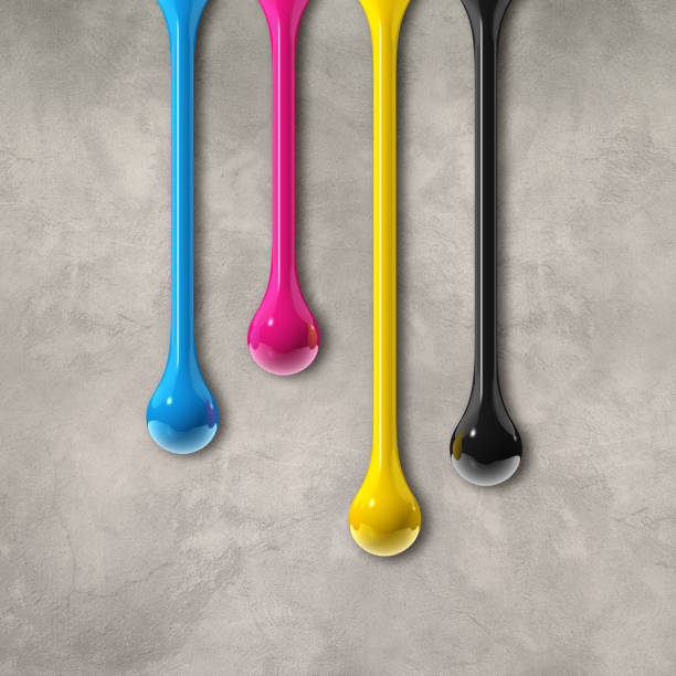 istock cmyk ink drops on grey concrete square background 1325348736