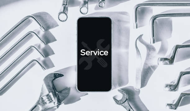 istock Repair phone. Technician workplace with phone and special repairing tools. Disassembling, diagnostic and repairman smartphone. 1325349658
