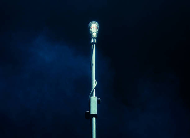 istock Microphone on dark background, music instrument concept 1325352843