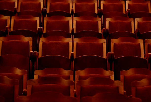 istock numbered theater chairs with red velvet 1325352846