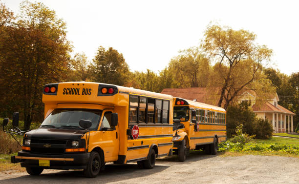 istock View of school buses on colorful Nova Scotia road in fall. 1325353720