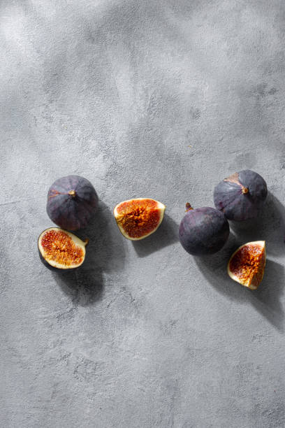 istock Overhead view sliced and whole fresh figs 1325354514
