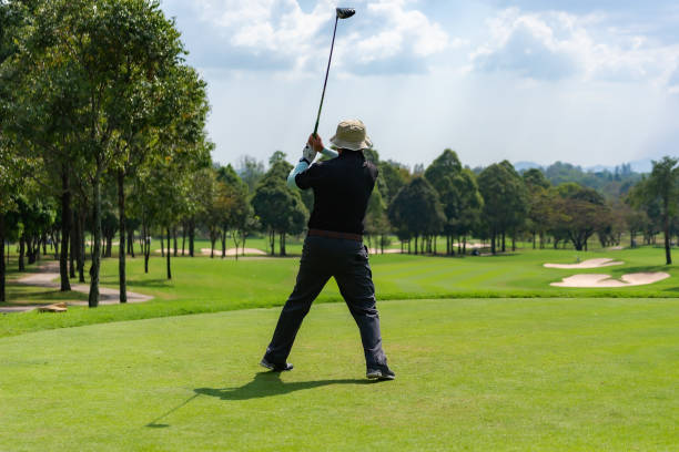 istock golfer doing a practice swing. Healthy and Lifestyle Concept. 1325357928
