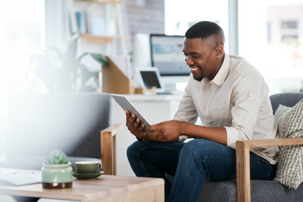 istock Shot of a young businessman using a digital tablet in an office 1325363429