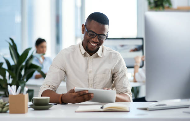 istock Shot of a young businessman using a digital tablet in an office 1325363471