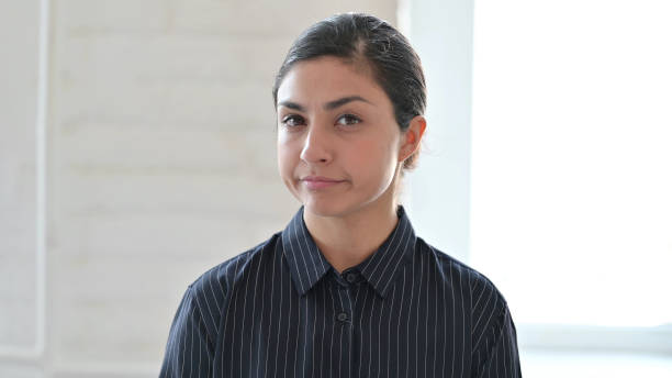 istock Young Indian Woman showing No Sign by Head Shake 1325363476