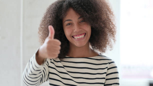 istock Positive African Woman doing Thumbs Up 1325363479