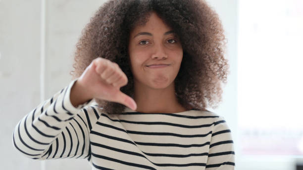 istock Disappointed African Woman doing Thumbs Down 1325363499