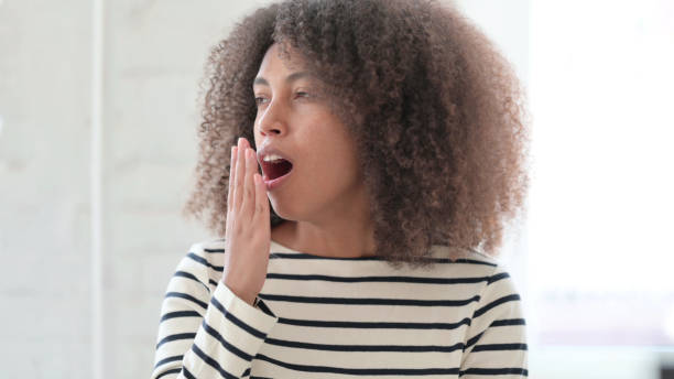 Exhausted African Woman Yawning, Need Vacations