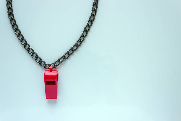 istock Sports whistle on a chain. Concept- sport competition, referee, statistics, challenge, friendly match. On a light background. Copy space. 1325363629