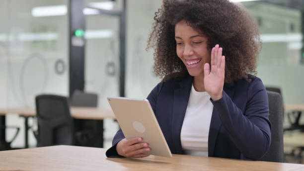 istock African Businesswoman doing Video Chat on Tablet 1325363675