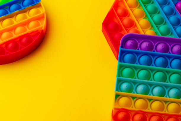 istock Colorful antistress pop it toy on yellow background 1325367800