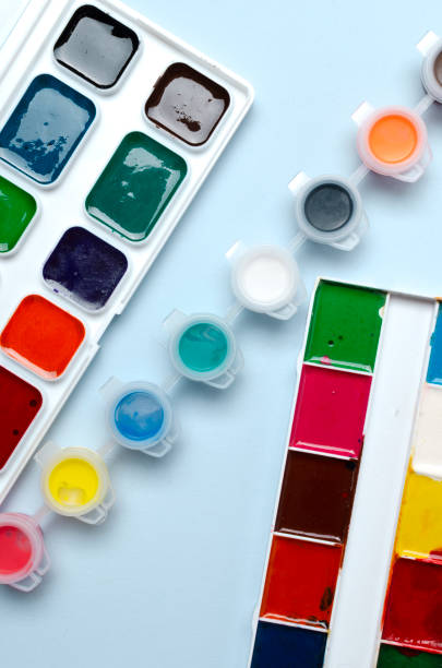istock Vertical image.Collection  of colorful watercolor on the blue surface 1325369588