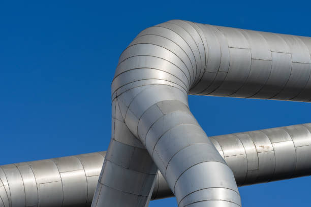 istock Low Angle View Of Pipe Against Clear Blue Sky 1325370096