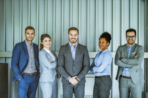 istock Happy business team in the office. 1325370107