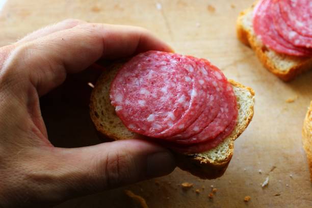 A simple sandwich with sausage rustic style