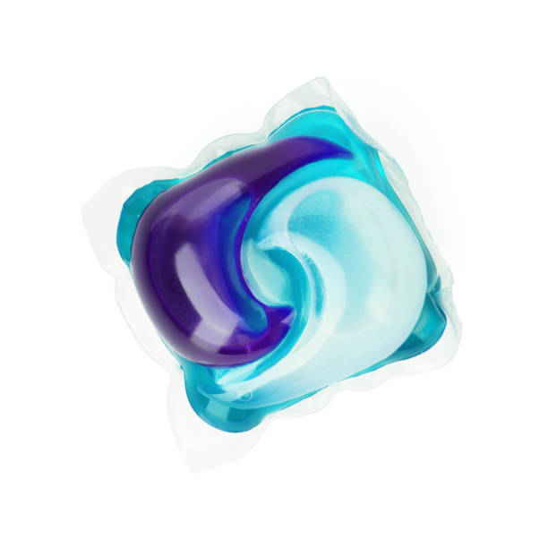 capsule of detergent powder, isolated on white capsule of detergent powder, isolated on white background. detergent capsule stock pictures, royalty-free photos & images