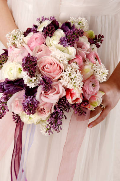 istock white background flowers in girl's hand 1325373819