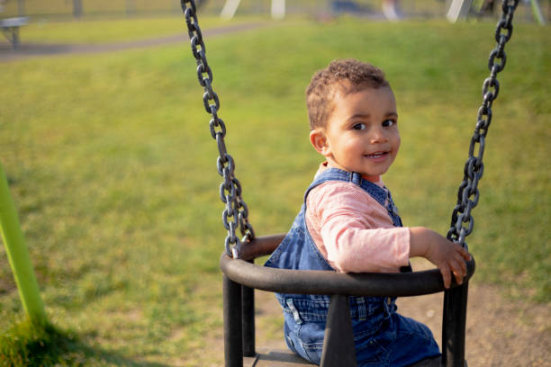 istock Cute Toddler on a Swing 1325373835