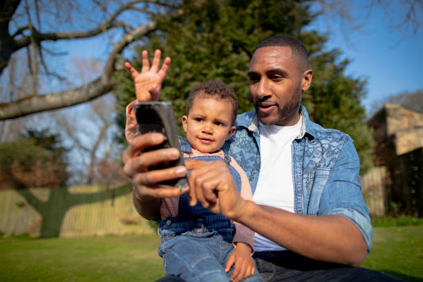 istock Father and Son Taking a Selfie 1325373843