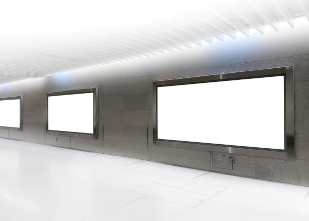 istock Blank billboards of advertising space for mock up; OOH ad placement. Large format poster at pedestrian walkway of train station 1325376049