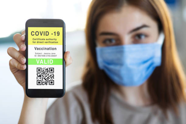 istock Mobile phone with vaccination certificate passport 1325380049