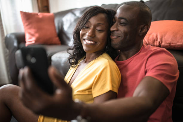 istock afro american couple relaxing on the sofa 1325380370