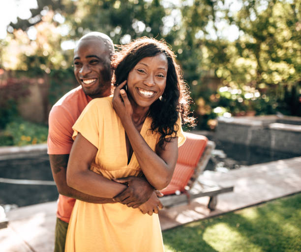 istock couple flirting at the pool side 1325381258