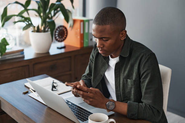 istock Shot of a young businessman using his smartphone to send a text 1325381565