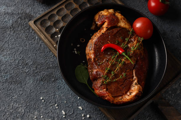 istock raw organic meat spices 1325381785